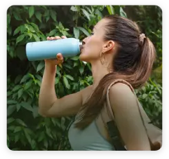 lady sips water from UVBrite 